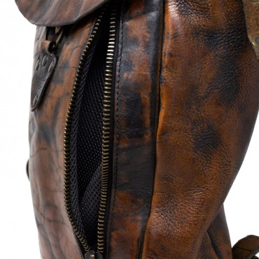 Leather medium backpack with side zipper. Cognac
