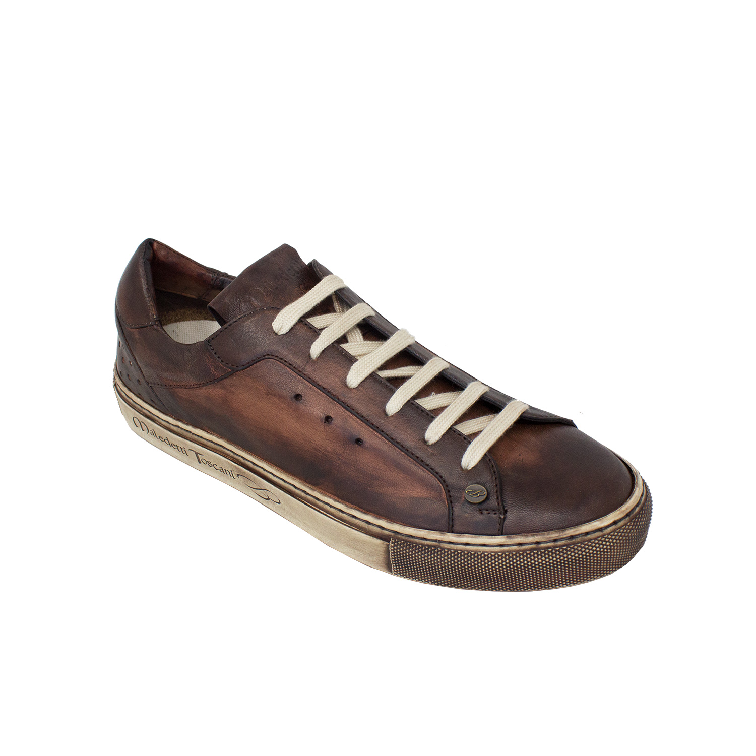 Leather Sneakers. The high-top sneaker is made of vegetable-tanned sheep leather.
