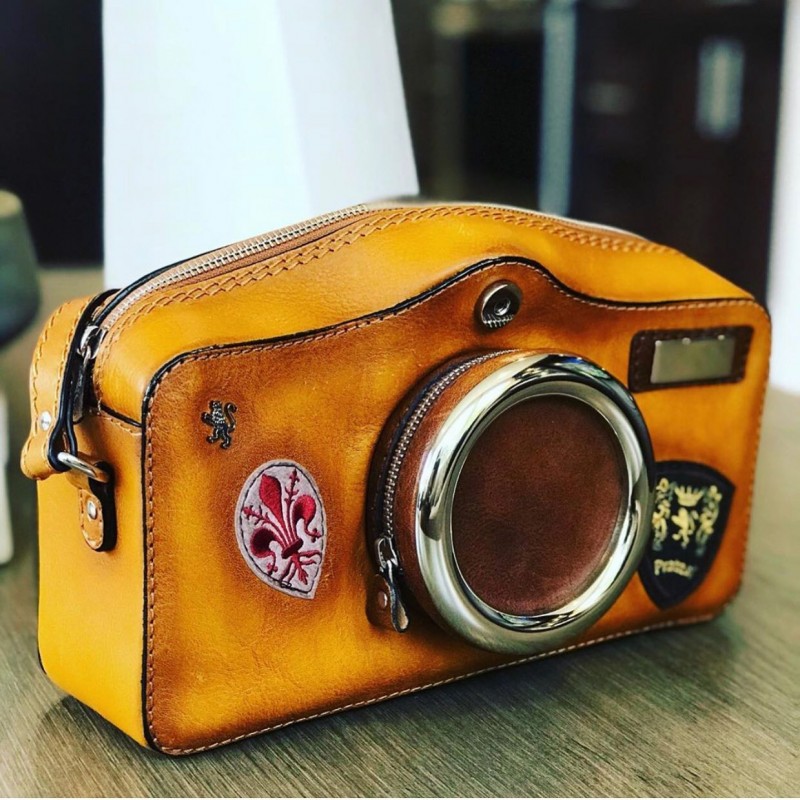 Exclusive leather camera bag  woman. The shape of this model is reminiscent of a traditional camera.