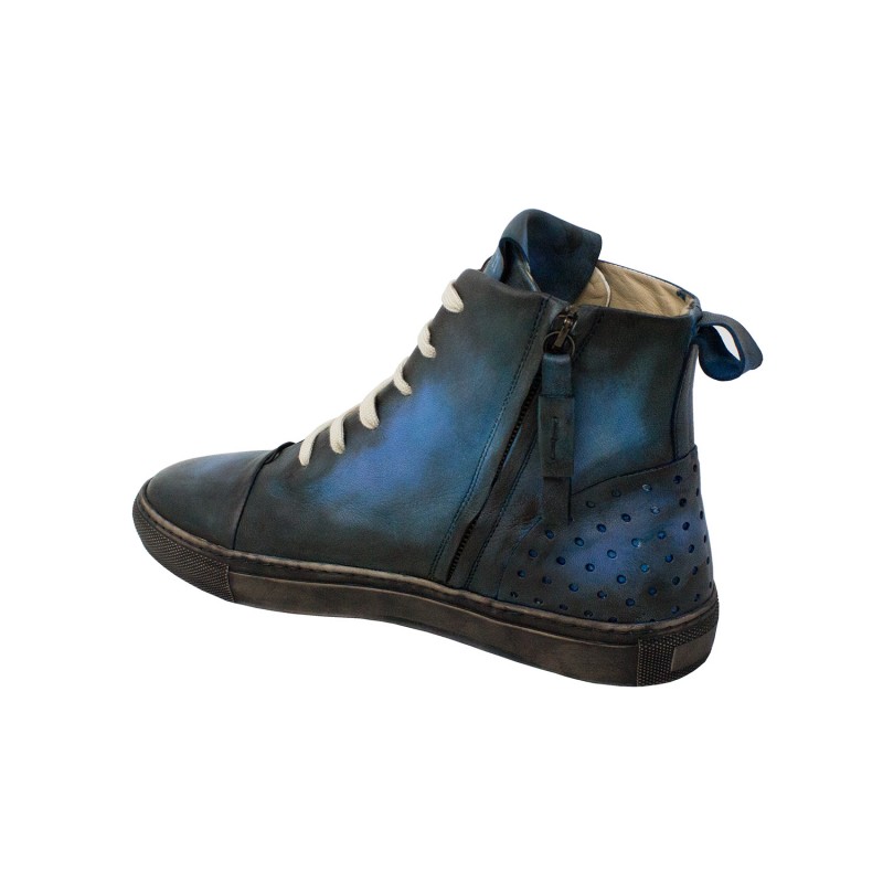 Leather Sneakers. The high-top sneaker is made of vegetable-tanned sheep leather.